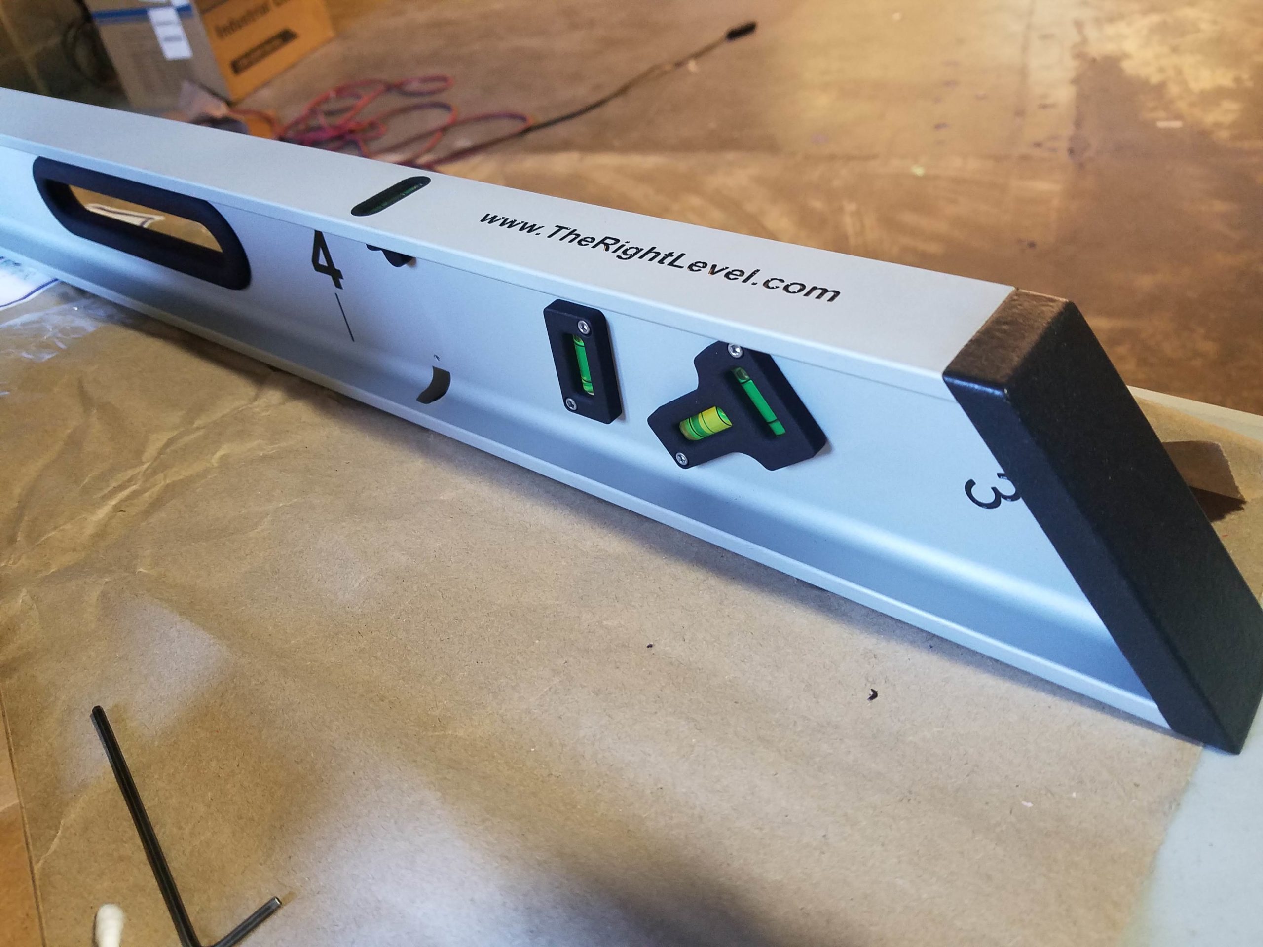 The photograph shows a closeup of the 53.13-degree beveled edge of The Right Level.